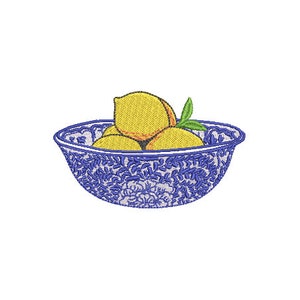 May include: A blue and white patterned bowl filled with yellow lemons. The bowl has a floral design.