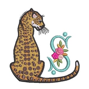 May include: An embroidery design featuring a seated leopard with a golden-brown coat and dark brown spots, positioned next to a large, light blue cursive letter S decorated with pink and peach-colored flowers and green leaves.