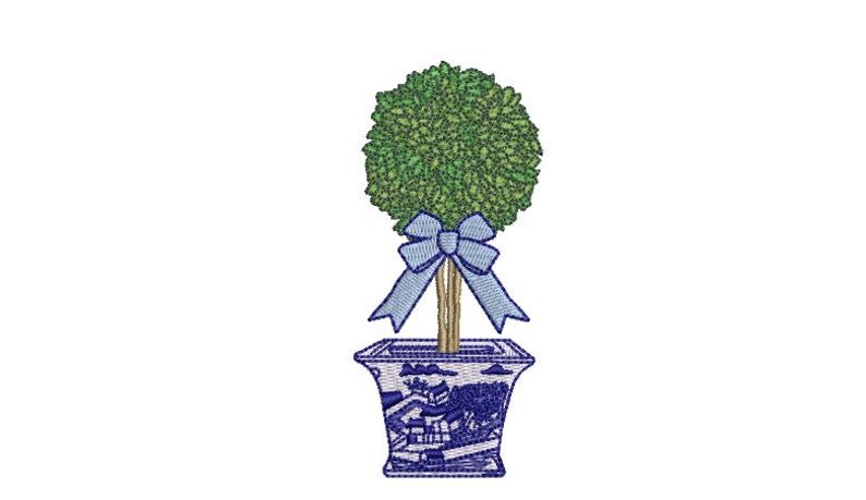 May include: A topiary tree with green leaves in a blue and white ceramic pot with a blue bow.