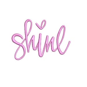 May include: A light pink embroidered design featuring the word shine in a cursive script font. The lettering has a raised, textured appearance with a distinct stitch pattern throughout the letters, including a small heart shape above the letter i.