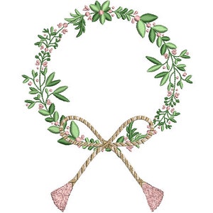 May include: An embroidery design featuring a circular wreath composed of green leaves and small pink flowers. At the bottom, a tan rope-style bow is tied, featuring two long ends that terminate in textured, light pink tassels hanging downwards.