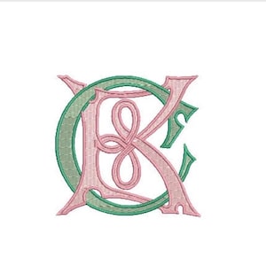 May include: An embroidered monogram featuring the intertwined letters C and K. The letter C is rendered in a textured green thread, while the letter K is stitched in a soft pink thread. The design showcases detailed needlework and stitching.