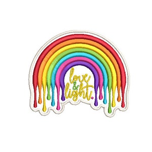 May include: A rainbow with dripping paint, in the colours red, orange, yellow, green, blue, indigo, and violet. The rainbow has the words "love & light" written in gold inside the arch.