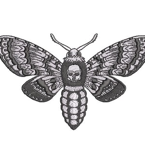 May include: Black and white embroidered design of a moth with a skull in the centre of its body.