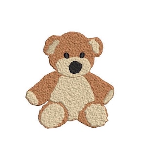 May include: An embroidered patch featuring a brown teddy bear with a light beige belly, muzzle, and inner ears. The bear has two small black circular eyes and a black oval nose, with visible thread texture throughout the entire design.