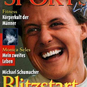 May include: Magazine cover featuring a smiling man with the word "SPORTS" in large red letters. The cover includes text in German and features Monica Seles and Michael Schumacher. The headline reads "Blitzstart".
