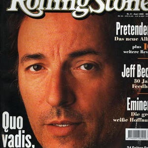 Puede incluir: Portada de la revista Rolling Stone con Bruce Springsteen en primer plano. La portada incluye el texto "Quo vadis, Bruce?" y titulares sobre Pretender, Jeff Beck y Eminem.