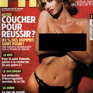 Puede incluir: Un número de febrero de 2004 de la revista FHM con una portada que muestra a una persona posando sobre un fondo rojo. La portada incluye texto como Ingrid Chauvin, Coucher pour réussir y varios titulares impresos en fuentes blancas, amarillas y negras.
