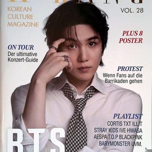 May include: K-BANG Vol. 28 Korean Culture Magazine cover featuring a person with dark hair wearing a white collared shirt and a black and white houndstooth tie. The text includes BTS, On Tour, Protest, and Playlist with various artist names.