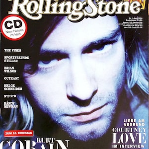 Puede incluir: Una portada de la revista Rolling Stone de abril de 2004 con un retrato de Kurt Cobain. El texto incluye 'DAS 16-SEITEN-SPECIAL: FLEETWOOD MAC', 'New Noises im Heft', 'KURT COBAIN', 'DAS PROTOKOLL DER LETZTEN SESSIONS' y 'COURTNEY LOVE IM INTERVIEW'.