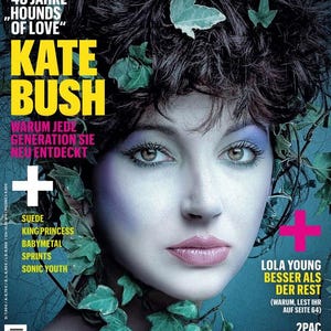 May include: Magazine cover featuring Kate Bush with dark hair adorned with green leaves. The magazine title "musikexpress" is in pink, with the issue number "10/25". Text includes "40 Jahre 'Hounds of Love'" and "Warum jede Generation sie neu entdeckt".