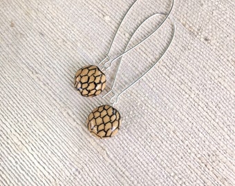 Honeycomb Earrings. Ceramic beads with hand drawn honeycomb pattern on kidney-shaped hypoallergenic wires. Simple dangle bee lover earrings