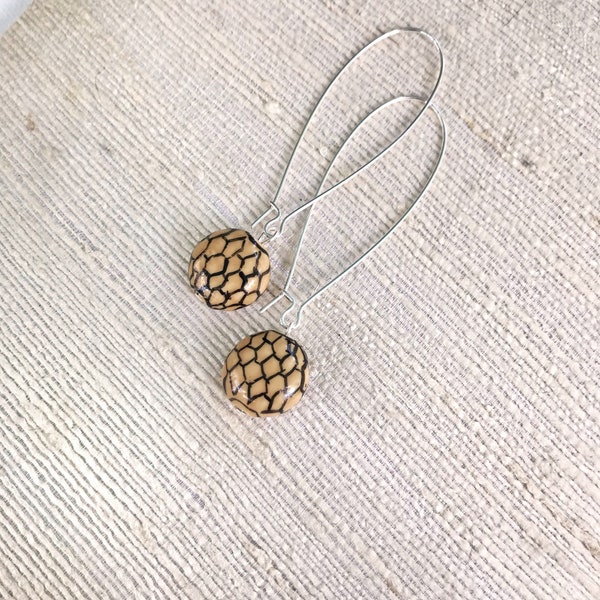 Honeycomb Earrings. Ceramic beads with hand drawn honeycomb pattern on kidney-shaped hypoallergenic wires. Simple dangle bee lover earrings