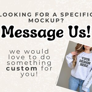 May include: A gray sweatshirt with the text "YOUR DESIGN HERE" on the front and "YOUR DESIGN" on the sleeve. The sweatshirt is being modeled by a person with long brown hair.