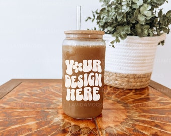 May include: A clear glass tumbler with a bamboo lid and a glass straw, filled with a brown beverage. The tumbler has the text "YOUR DESIGN HERE" in a retro font. The tumbler sits on a wooden table.