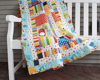 Silly Monsters Patchwork Quilt in Blue