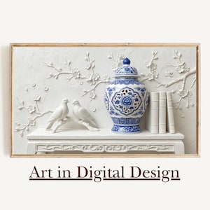 May include: A framed wall art piece featuring a white relief sculpture with floral and bird motifs. A blue and white porcelain jar sits on a white shelf with three white books. The text "Art in Digital Design" is at the bottom.