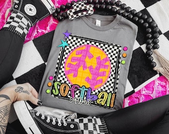 May include: Gray t-shirt with a colorful graphic of a softball in a checkered box. The graphic says "Softball" with a rainbow color scheme.