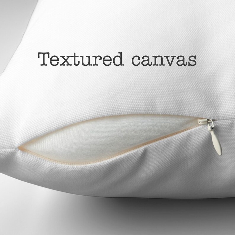 This image shows a blank pillow cover in the textured canvas fabric option. Also the zipper is partially unzipped revealing the pillow insert.