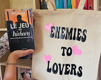 totebag enemies to lovers