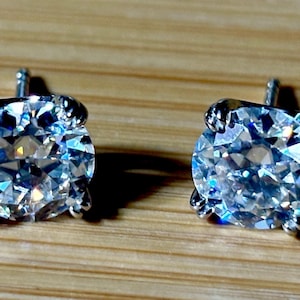 A lovely certified pair of 4cttw Old European Cut Moissanite studs in 935 Argentium silver double-claw mountings, 18k Seiko-electroplated!