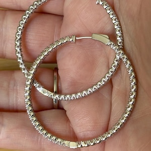 Moissanite hoops. A certified 2.88cttw pair of BIG 45mm inside-out hoops with patented “locking” closures! Fear not, they’re going nowhere!