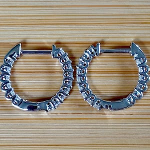 Moissanite huggies. A .45cttw pair of *true* huggy earrings, small yet solidly constructed, in sterling silver with 18k white gold plating!