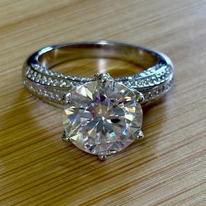 Moissanite ring. The 5ct “Rose Bloom” ring, the fully pavéed daughter of the 10ct! A step down in size but certainly not in icy sparkle!