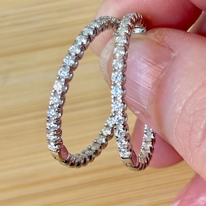 Moissanite hoops. A certified 1.56cttw pair of inside-out hoops, with patented “locking” closures for worry-free wear! So boogie down!