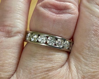 Moissanite ring. A 5.10cttw or 4.8cttw (depending on size) Moissanite eternity ring. A channel-set, classy and classic design - beautiful!