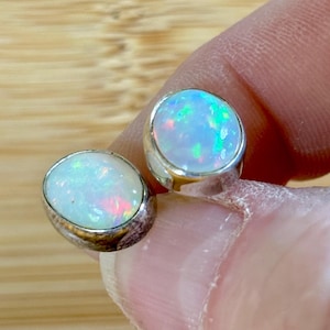 Ethiopian opal earrings, pair A. A beautiful pair of Ethiopian opal earrings, approximately 4cttw and hand-set in sterling silver bezels!