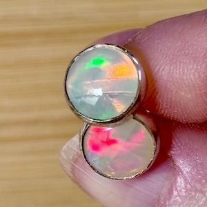 Ethiopian opal earrings, pair C. A beautiful pair of Ethiopian opal earrings, approximately 4cttw and hand-set in sterling silver bezels!