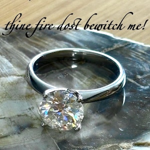 Moissanite solitaire. A gorgeous 3ct certified Moissanite in a rosebud leaf-shaped solitaire setting of 18k gold-embraced sterling silver!