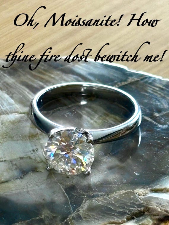 Moissanite solitaire. A gorgeous 3ct certified Moissanite in a rosebud leaf-shaped solitaire setting of 18k gold-embraced sterling silver!