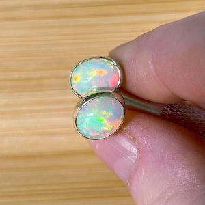Ethiopian opal earrings, pair D. A beautiful pair of Ethiopian opal earrings, approximately 4cttw and hand-set in sterling silver bezels!