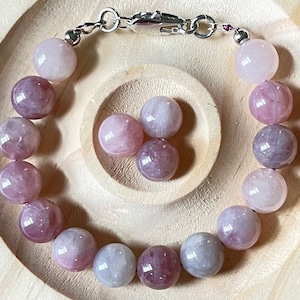 Madagascar rose quartz bracelet. Hands-down GORGEOUS 10.5mm purple-pink rose quartz beads with varying degrees of crystallization and color!