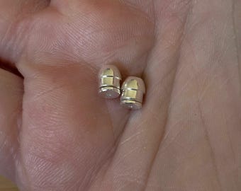 Locking earring backs (stainless steel), sterling silver replacement backs and silicone backs.