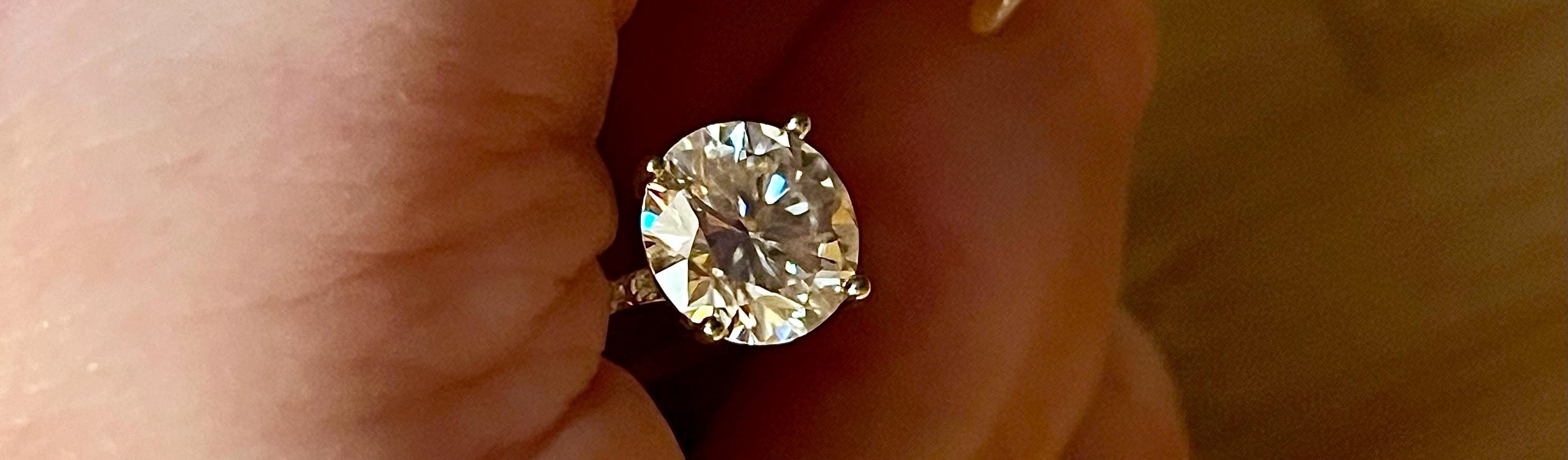 Moissanite ring. A gorgeous 3ct certified round radiant solitaire in a 4-prong basket setting with white zircon shoulders!
