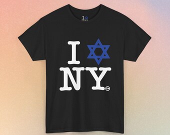 May include: A black short-sleeve t-shirt featuring the white text I and NY with a blue Star of David replacing the heart symbol. The shirt includes a small trademark symbol next to the text and a small I and Star of David logo on the inner neck.
