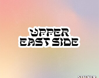 May include: A die-cut sticker featuring the black text UPPER EAST SIDE in a stylized, bold font with a white border. In the bottom right corner, there is a smaller logo with the text STICKER KWEEN in a stacked, multi-colored outline font.