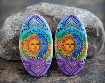 Sun and Moon. Polymer clay and resin earring pair. Oval earring components. Transferred image graphic beads. Lightweight. Made to Order.