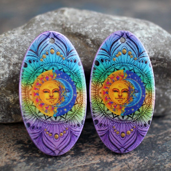 Sun and Moon. Polymer clay and resin earring pair. Oval earring components. Transferred image graphic beads. Lightweight. Made to Order.