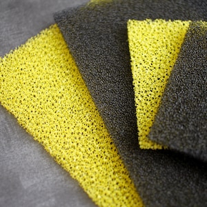 Premium Photo  Flat black foam rubber sponge texture and background