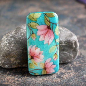 Magnolias on Teal.  Polymer clay and resin Cabochon. Transferred image. Bead embroidery cabs. Lightweight. Made to Order. 1 x 2 inches.