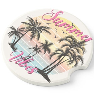 May include: Round white coaster with a colorful sunset and palm trees graphic. The text "Summer Vibes" is written in pink cursive.