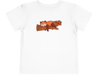 May include: White t-shirt with a cartoon image of a red panda sleeping on a branch.