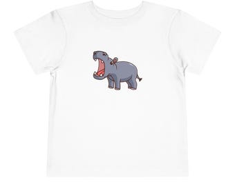 May include: White t-shirt with a cartoon image of a gray hippopotamus with an open mouth.