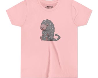 May include: Pink t-shirt with a cartoon illustration of a pangolin. The illustration is in grey and white with pink accents. The text "ZOO GUIDE" is printed on the shirt.