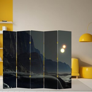 Dark sci fi landscape canvas room divider folding screen used as a privacy panel in a modern studio interior