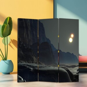 Dark sci fi landscape canvas room divider folding screen used as a privacy panel in a modern studio interior
